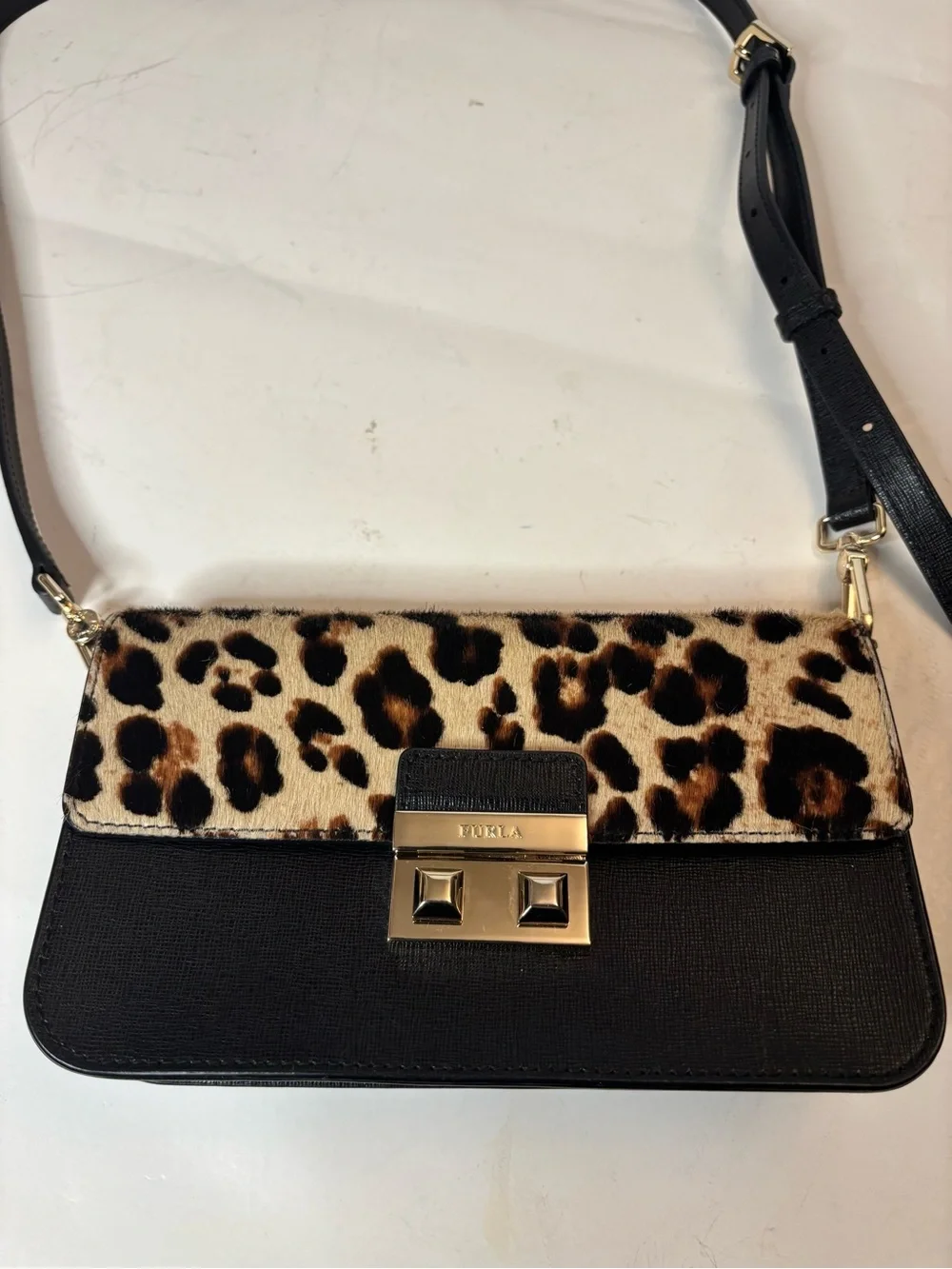 Furla Bella mini crossbody with leopard print calf hair and leather. Adjustable